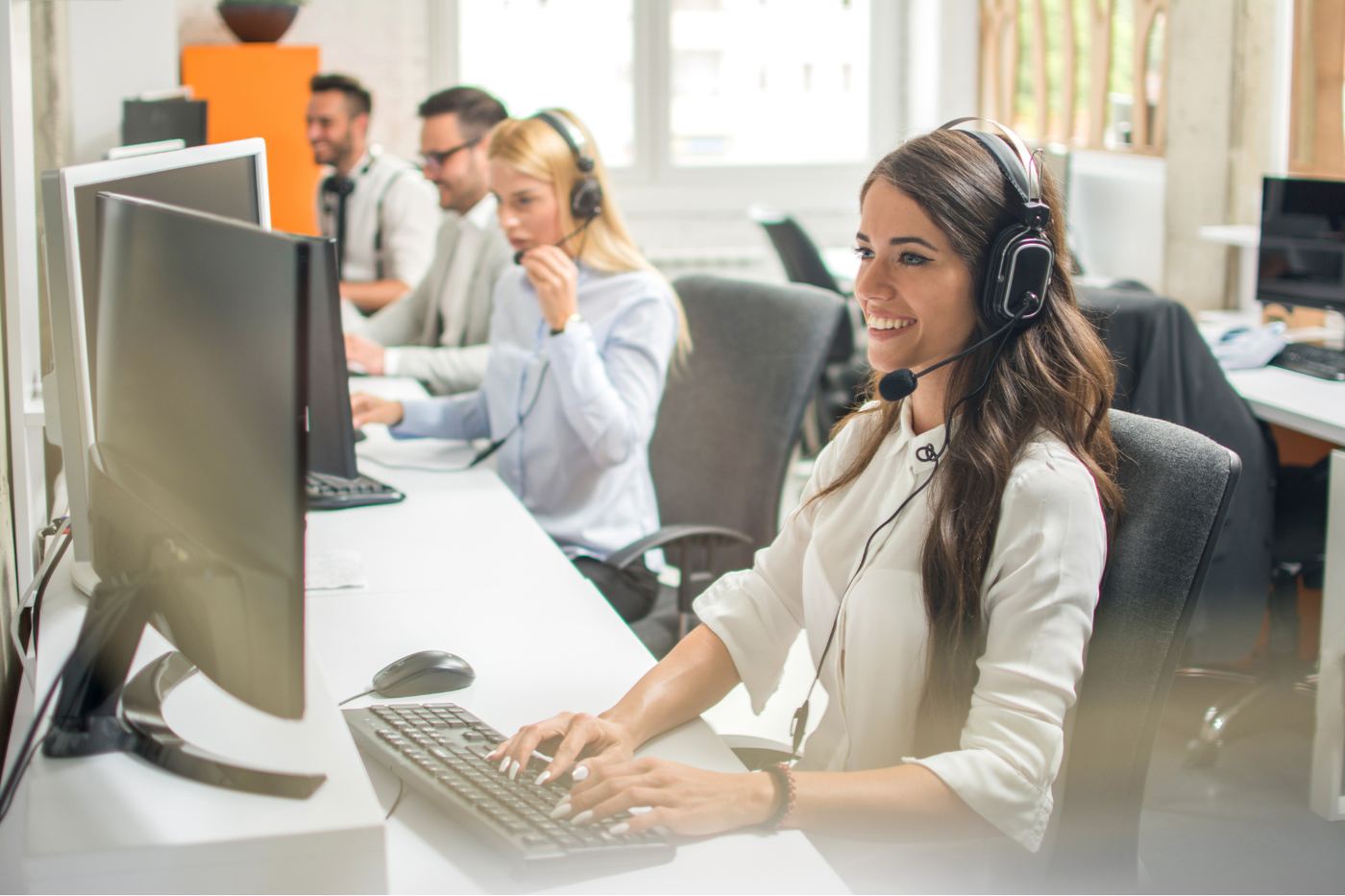 Customer engagement team working alongside AI-assisted workflows